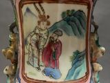 a vase with a picture of a man and a woman on it