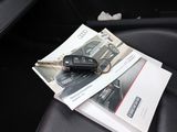 a car key sitting on top of a book in a car