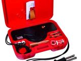 an image of a red case with tools in it on a white background