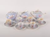 six pieces of porcelain tea and coffee set on a white surface