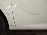 a picture of a car with a dent in the side of it
