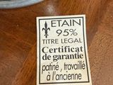 a sticker on a table that has a piece of cake on it