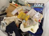 a bag full of items that are sitting in a trash can