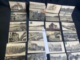 several old black and white photographs of buildings and buildings on a table