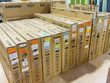 boxes of samsung electronics are stacked on top of each other in a store