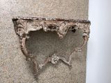 a picture of a wall mounted shelf in a bathroom