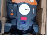 a cardboard box that has a small machine inside of it