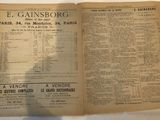 an old newspaper with a bunch of information on it on a table