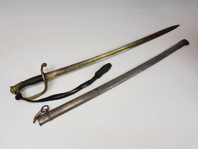 two old swords are sitting next to each other on a table