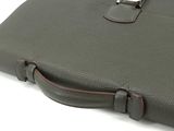 a close up of a brown briefcase with a lock on it