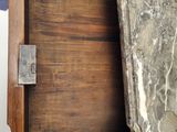 a close up of a wooden door with a metal latch