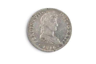 an old silver coin on a white surface with a white background