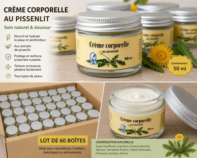 some jars of cream sitting on top of a table next to a box of flowers