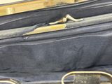 a suitcase that has a pair of scissors inside of it