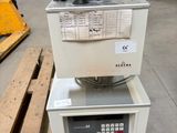 the machine is sitting on top of the pallet in the warehouse