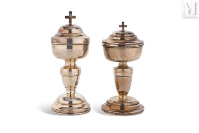 pair of silverplated candlesticks with crosses on top
