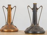 two vases that are sitting on a table