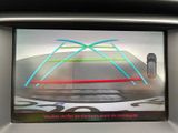 a picture of a car ' s rear view mirror with a picture of a car on it