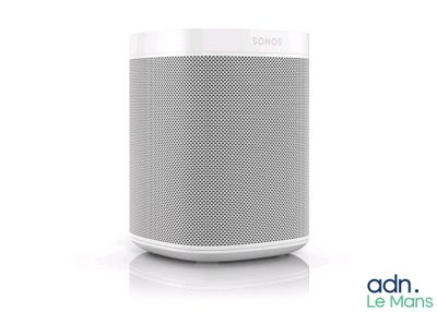 an image of a white and gray speaker sitting on top of a table