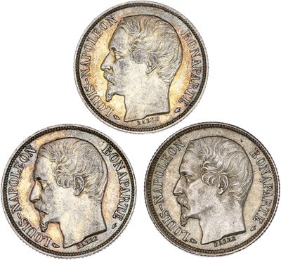 three british silver sovereigns, one of which has a head of a woman and one of which is a