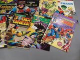 a lot of comic books sitting on a table