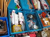 many boxes of assorted items sitting on the floor