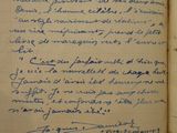 an open book with a handwritten poem on it sitting on a table