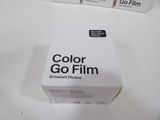 a box of color go film sitting on a table