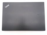a black laptop that is sitting on a white surface