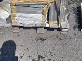 a man that is standing next to a pile of boxes