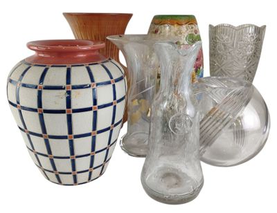 many different vases and glasses on the table