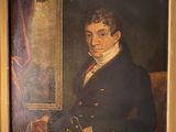 portrait d'un homme en manteau noir avec un chien
