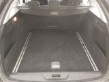 a trunk of a car with the back door open