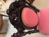 a chair that is sitting in a room with many chairs around it
