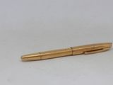 a pen that is laying on a table