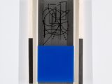 a blue and black painting on a white wall next to a black and white wall