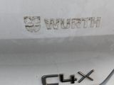 a close up of a white car with the number 9 on it
