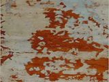 an image of a close up of a wall with peeling paint on it