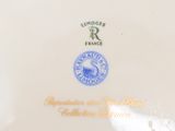 a white plate with a blue and white design on it