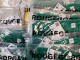 many bags of green and white items on a table