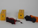 three toy trains sitting next to each other on a white surface