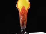 a glass vase that is sitting on a table