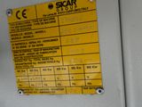 a yellow sign on the wall of a machine