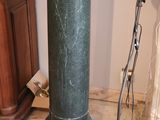 an image of a green pedestal sink in a bathroom