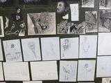 many drawings on the wall of this room