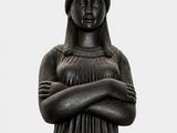black and white photograph of a statue of a woman with a crown on her head