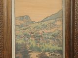 an old picture of a picture of a mountain scene in a wooden frame
