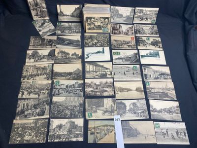 a lot of old black and white photos on the table