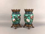two vases that have been painted with flowers on them