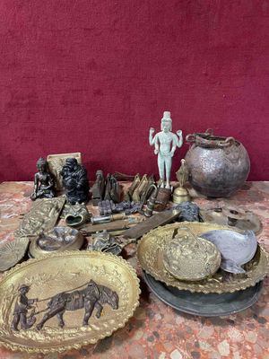 a table with a lot of antique items on it